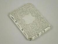 An embossed silver cigarette case