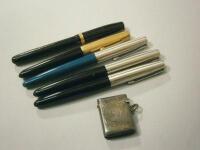 A silver vesta case and various pens