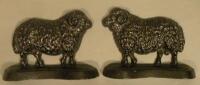 A pair of cast iron doorstops each in the form of sheep