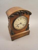 A late 19thC-early 20thC figured mahogany and marquetry mantel clock