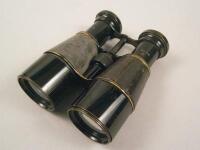 A pair of army issue ebonised brass and leather field binoculars