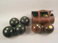 Two sets of Lignum bowling balls