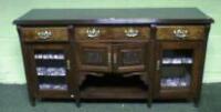 A late Victorian walnut sideboard with moulded top