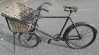 An early 20thC tradesman's delivery bicycle with basket (AF).