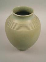 A 1930s green stoneware vase