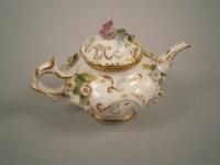 A mid 19thC Staffordshire flower encrusted porcelain miniature teapot