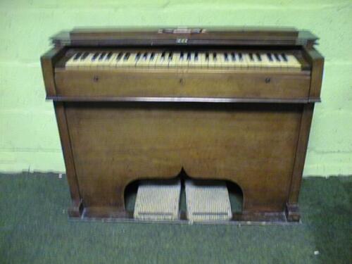 A Victorian walnut harmonium by Barnett Samuel of London