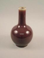 A Chinese Sang De Boeuf glazed porcelain bottle shaped vase