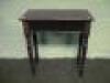 An Edwardian mahogany side table with moulded top