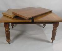 A Victorian walnut extending dining table