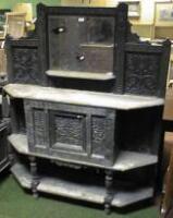 A Victorian sideboard in carved oak in the Jacobean style