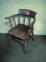 A late Victorian elm smoker's bow chair with H-frame stretcher