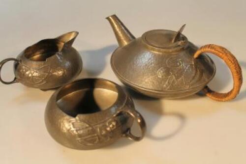 A Tudric pewter three piece tea service