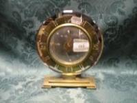 A BEM electric clock with brass dial ring and base