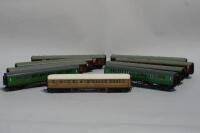 Nine unboxed model railway carriages