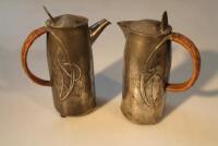 Two Tudric pewter hot water jugs