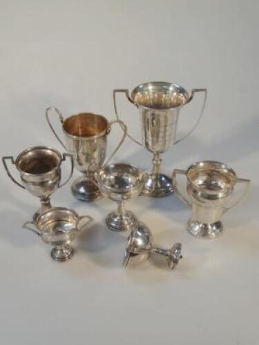 A collection of six silver prize cups