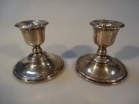 A pair of George V silver dwarf candlesticks