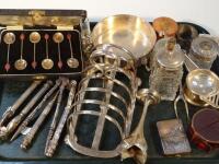 A collection of silver plated items including a toast rack and bean handled coffee spoons