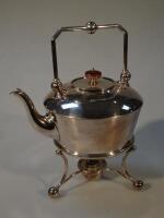 A silver plated Tea kettle with spirit burner stand.