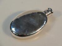 A Victorian silver oval hip flask with bayonet cap