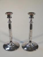 A pair of early 20thC electroplated candlesticks 28cm high.