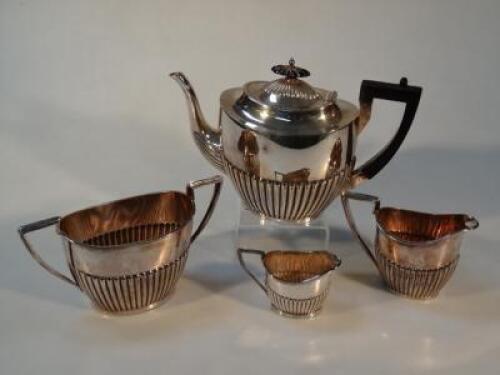 A Walker and Hall silver plated four piece tea service.