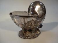 A 19thC silver plated spoon warmer in the form of a nautilus shell.