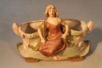 A Royal Dux rose bowl modelled with a woman and lilies