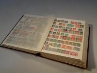 A stock book and a collection of used British Commonwealth and world stamps.