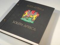 A presentation stamp album with a collection of used and unused South African stamps
