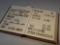 A stock book and a collection of used stamps for Australia.