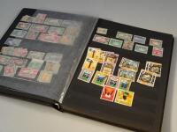 A stock book containing stamps for Tanzania and Zanzibar