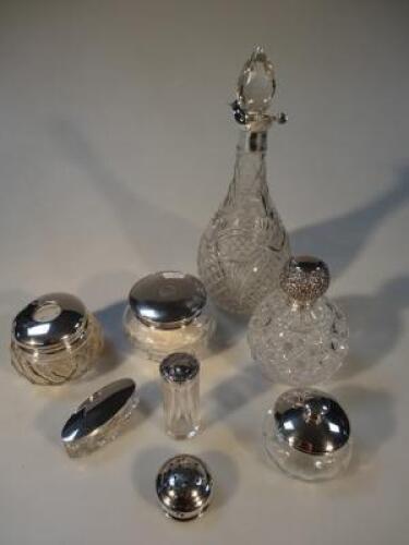 Various silver topped glass bottles