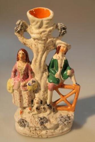 A mid 19thC Staffordshire group of figures beneath a tree with a dog