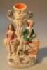 A mid 19thC Staffordshire group of figures beneath a tree with a dog