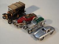 Four Franklin Mint scale model cars