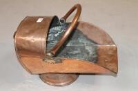 A copper and brass coal scuttle.