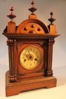 A late Victorian oak cased mantel clock