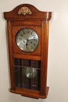 A mid 20thC oak cased wall clock