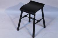 An Art Nouveau style ebonised stool.