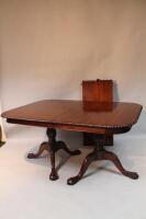 A 20thC mahogany and twin pedestal dining table