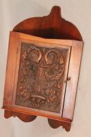 A mahogany corner cupboard