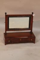 An 18thC mahogany dressing table mirror.