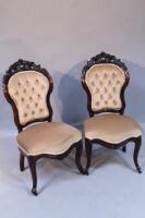 A pair of late Victorian upholstered dining chairs.