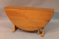 An Ercol style drop leaf dining table