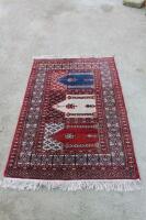 A modern red ground Persian rug