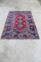 A modern Persian geometric patterned small rug