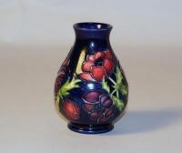 A Moorcroft 'Poppy' pattern baluster vase