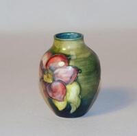 A Moorcroft 'Hibiscus' pattern urn shaped vase